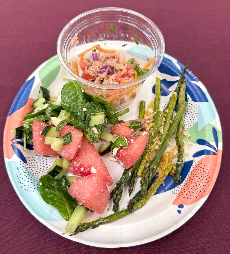 The meal at the Mediterranean cooking class on Dec. 5, 2025, consisted of a watermelon fruit salad, jalapeno tuna salad on cucumbers slices, and baked asparagus with Parmesan cheese.